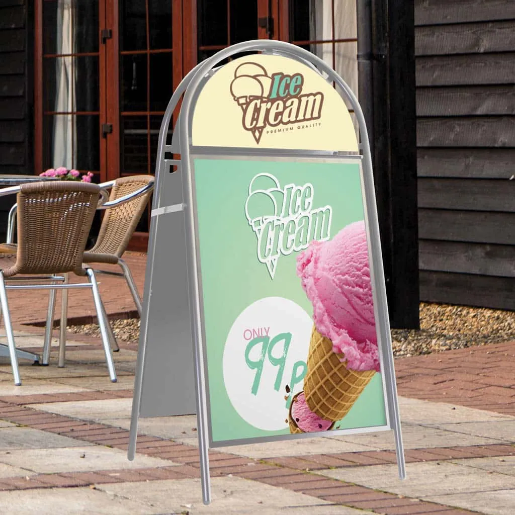 Traditional A-board advertising ice cream on a paved café terrace