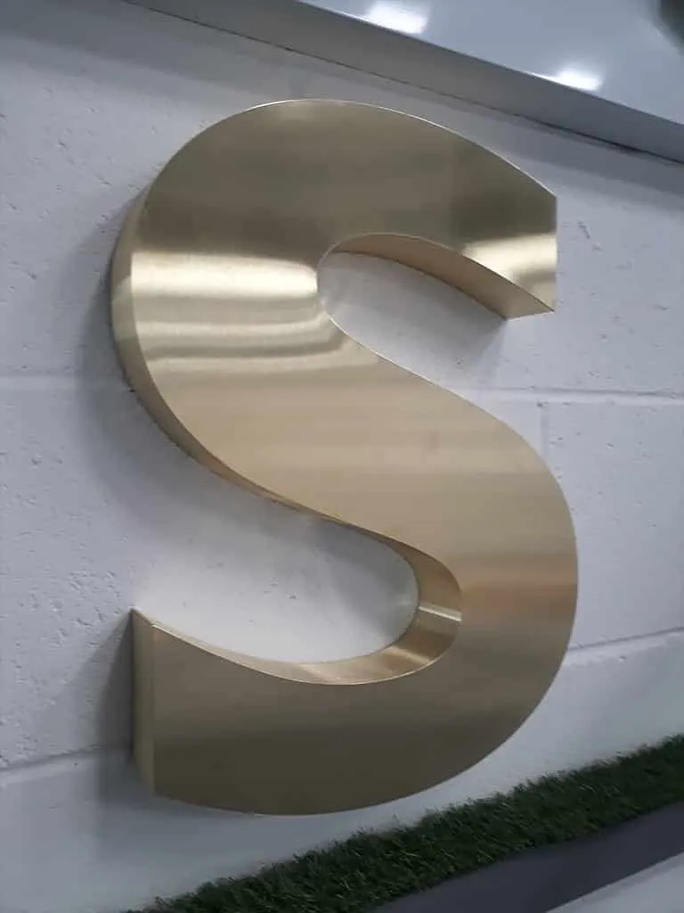 Letter S in brushed satin brass