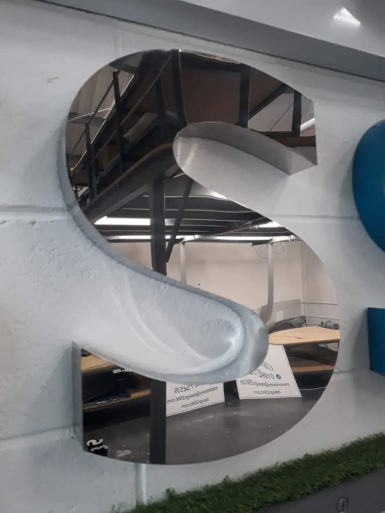 Letter S in polished mirror-finish stainless steel