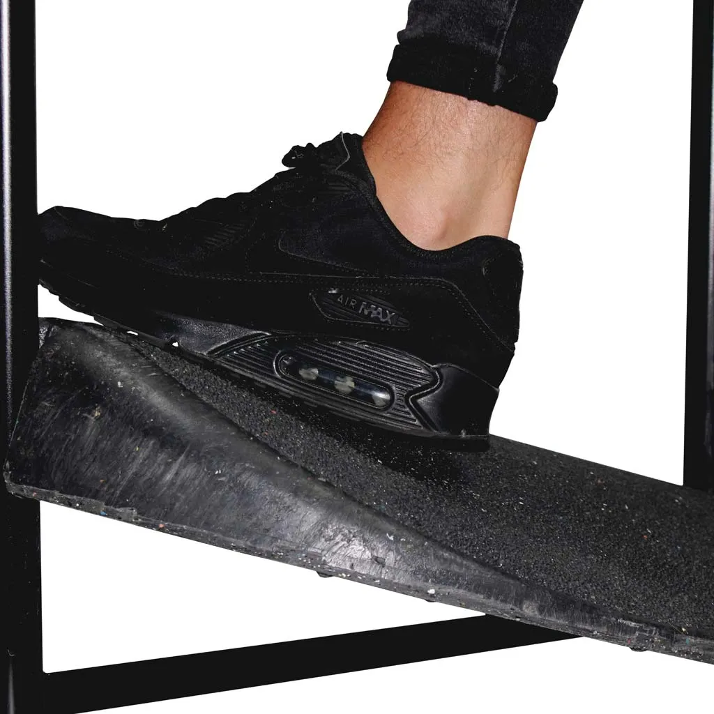 Foot resting on the recycled PVC base of a swing pavement sign