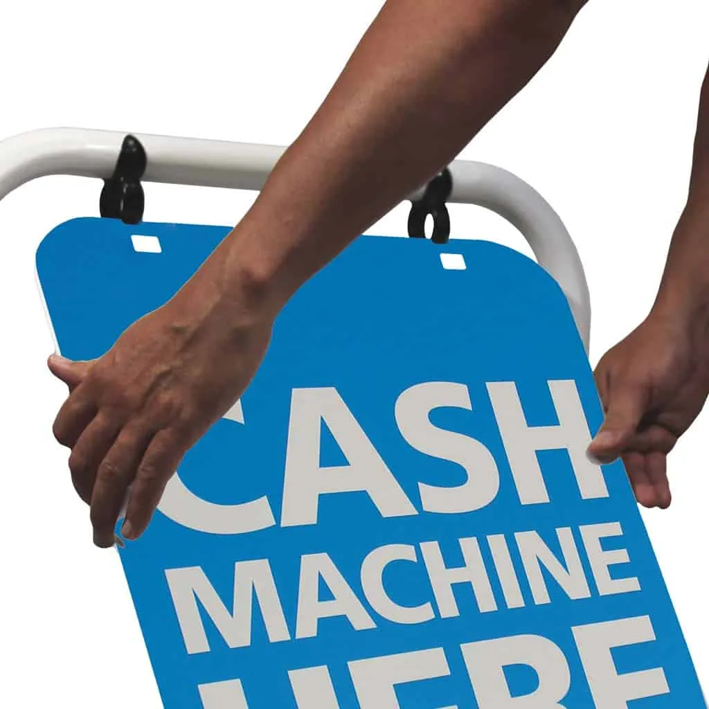 Blue cash machine panel being lifted into a swing sign frame