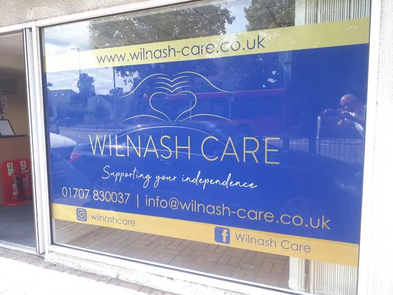 Printed Wilnash Care window graphics filling a shopfront window