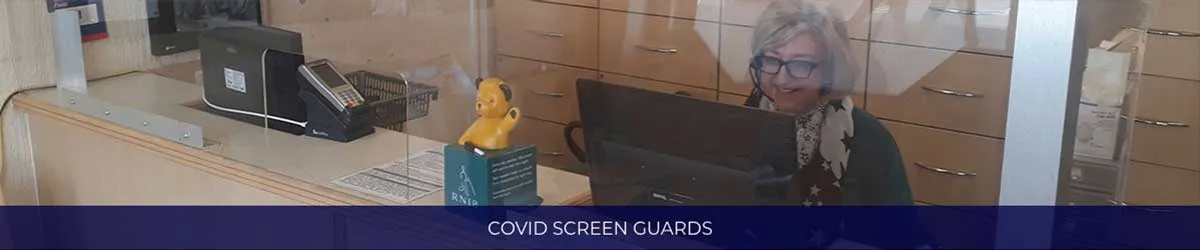 Clear perspex screen guard fitted across a reception counter, captioned Covid Screen Guards