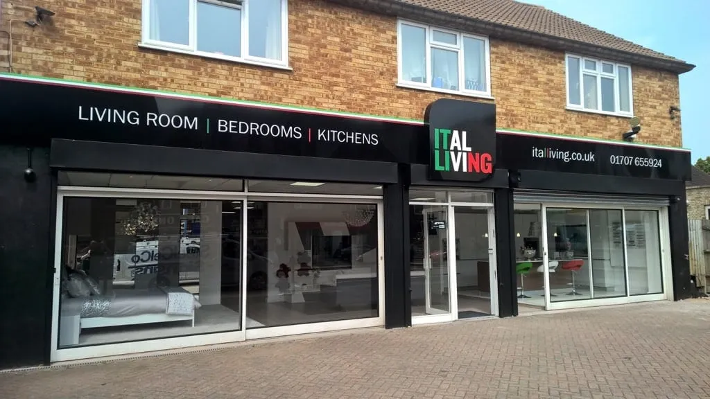 A black fascia sign reading Living Room, Bedrooms, Kitchens above the Ital Living showroom