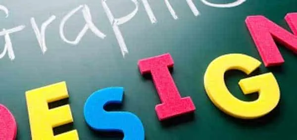 The words graphic design on a blackboard, spelled out in coloured plastic letters