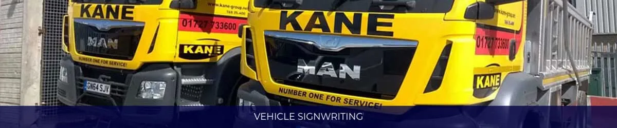 Two yellow Kane haulage lorries signwritten with the company name, logo and telephone number
